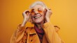 © inthasone - Happy and playful senior woman emotional having fun - Portrait of a beautiful lady above 70 years old with costumes stylish clothes, concepts about senior people and elderly age