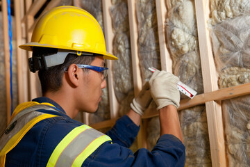 Professional worker working with innovative insulation