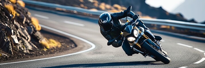 Wall Mural - Motorcycle through a series of sharp turns on a winding coastal road