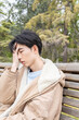 © ADDICTIVE STOCK - Young man experiencing hypoglycemia symptoms in a park