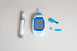 © ADDICTIVE STOCK - Diabetes monitoring tools displayed on a light background