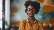 © CStock - A young African American woman entrepreneur standing confidently in front of her thriving business,