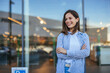 © Dragana Gordic - Portrait of a confident young woman standing at the park. Beautiful female in casuals looking at camera. Attractive woman wearing shirt and laughing