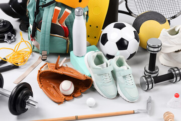 Canvas Print - Many different sports equipment on light grey background