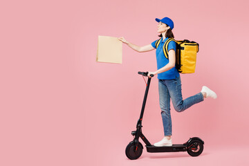 Sticker - Full body delivery woman wear blue cap t-shirt uniform workwear yellow thermal food bag backpack work as dealer courier ride e-scooter hold paper bag isolated on plain pink background Service concept