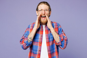 Wall Mural - Young smiling happy man he wear blue shirt casual clothes scream sharing hot news about sales discount with hands near mouth isolated on plain pastel light purple background studio. Lifestyle concept.