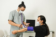© ADDICTIVE STOCK - Nurse checking blood pressure of patient in medical setting