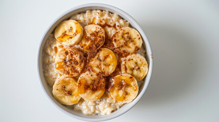 Canvas Print - A bowl of oatmeal with bananas and cinnamon