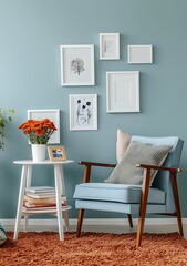 Wall Mural - A light blue wall with white photo frames, next to the frames is an armchair and coffee table on which there were books and flowers in pots