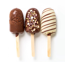 Canvas Print - Assortment of chocolate popsicles with almonds and nuts, arranged in a row, isolated on white background