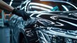© printartist - Car detailing specialist installing protective transparent foil or Car wrapping specialist putting vinyl foil or film on car