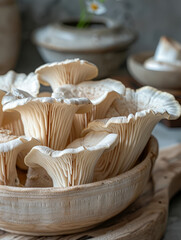 Wall Mural - Close-up of fresh mushrooms in a wooden bowl, rustic kitchen setting.