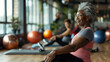 © Alison - Senior happy black woman enjoying a pilates class with friends. Yoga as a retirement hobby in old women. Inclusive and diverse communities keeping fit. Exercising for mental health.