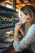 © Fabio - Businesswoman examining investment chart on computer
