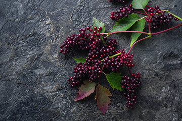 Wall Mural - A bunch of purple berries are on a black surface