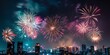 © gunzexx png and bg - A stunning and festive fireworks display lighting up the night sky above a bustling city skyline, indicating a celebration