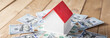 © Daniel - Wooden decorative house, banknotes around, apartment buying, selling concept stock photo