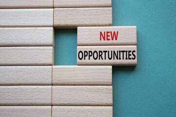 Wall Mural - New Opportunities symbol. Concept word New Opportunities on wooden blocks. Beautiful grey green background. Business and New Opportunities concept. Copy space