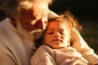 © alisaaa - Close up of grandfather hugging child girl in sunlight