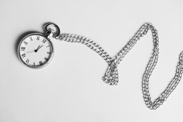 Sticker - Silver pocket clock with chain on light table, top view