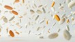 © Vilayat - White and orange pills falling on a white background for medical or pharmacy designs