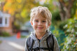 © Sage Studios - Happy Young White Boy with a Backpack Outside Ready for Back to School or a Hike