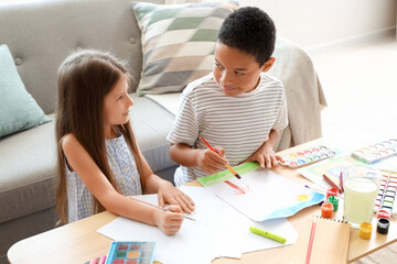 Wall Mural - Cute little children drawing at home