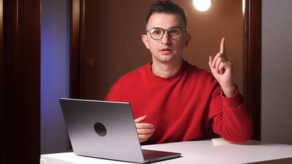 Eureka gesture young programmer freelancer man with glasses finding solution