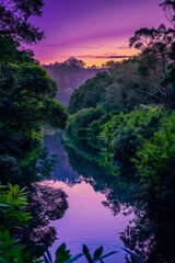 Wall Mural - A tranquil river winding through lush greenery, reflecting the colors of the purple sky as the sun sets, Generative AI