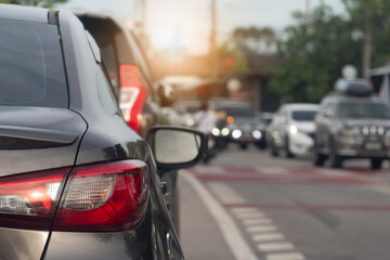 Wall Mural - Rear side of brown car. Traffic With many cars on asphalt road and opposit of crossroads road.