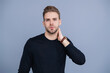 © be free - Millennial charismatic model. Men beauty. Guy with confident face. Young handsome man wearing casual sweater. Unshaven man isolated on grey. Portrait of man with stylish haircut. Magnetic Presence