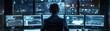 © ParinApril - Tech noir scene with a cybersecurity professional working in a dimly lit room, multiple screens displaying secure networks