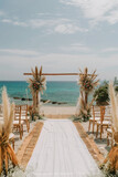 Fototapeta  - Seaside Wedding Arch Setup with Coastal View