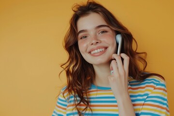 Wall Mural - A young woman chatting on her mobile phone. Suitable for technology concepts