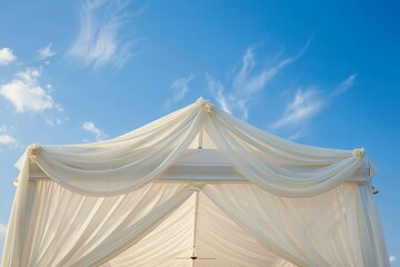 Wall Mural - Big white wedding tent for ceremonies set against blue sky