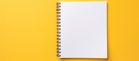 Poster - An isolated yellow background with a white open notepad provides plenty of copy space image