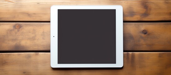 Sticker - A man s hands holding a tablet device over a wooden table with copy space image