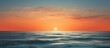 © HN Works - A tranquil evening seascape with an orange sea horizon offering a serene and peaceful sea view Perfect as a copy space image