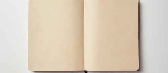 Wall Mural - A high angle view of an empty notebook with a recycled paper cover placed on a white background providing ample space for other images