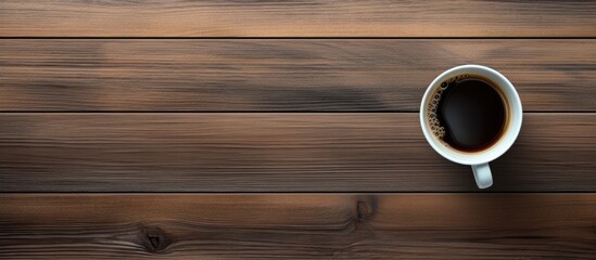 Fototapete - A top down view of an office desk displaying a cup of coffee with ample copy space for a flat lay image