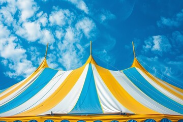 Wall Mural - Blue yellow and white circus tent pattern under blue sky