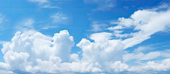 Poster - A picturesque scene of blue skies dotted with fluffy white clouds offering ample copy space for your artistic needs