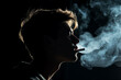 © Tetiana - Generative AI image of young man smoking cigar tabacco isolated on dark background