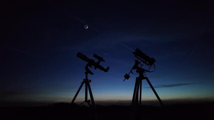 Wall Mural - astronomical telescope and camera on a startracker tripod for observing and capturing stars, planets