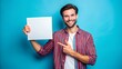 © Phonlasit - Portrait of attractive cheerful guy demonstrating copy empty blank space ad isolated over bright blue color background