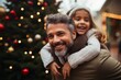 © Denis - a smiling little girl piggybacking on her father ,  christmas tree