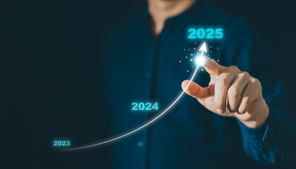 Businessman hand drawing arrow line with increasing direction from year 2023 to 2024 to 2025 for forecasting of business plan growing in long term, Happy New year with business growth plan concept