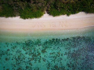 Wall Mural - Aerial view of Dan's Island against the turquoise sea