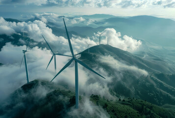 wind turbines on top mountain with clouds and fog