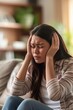 © Ingenious Buddy  - Japanese woman at home having a headache